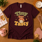 Tiny But Tasty cute food graphic t-shirt cozy flat lay in oxblood black.