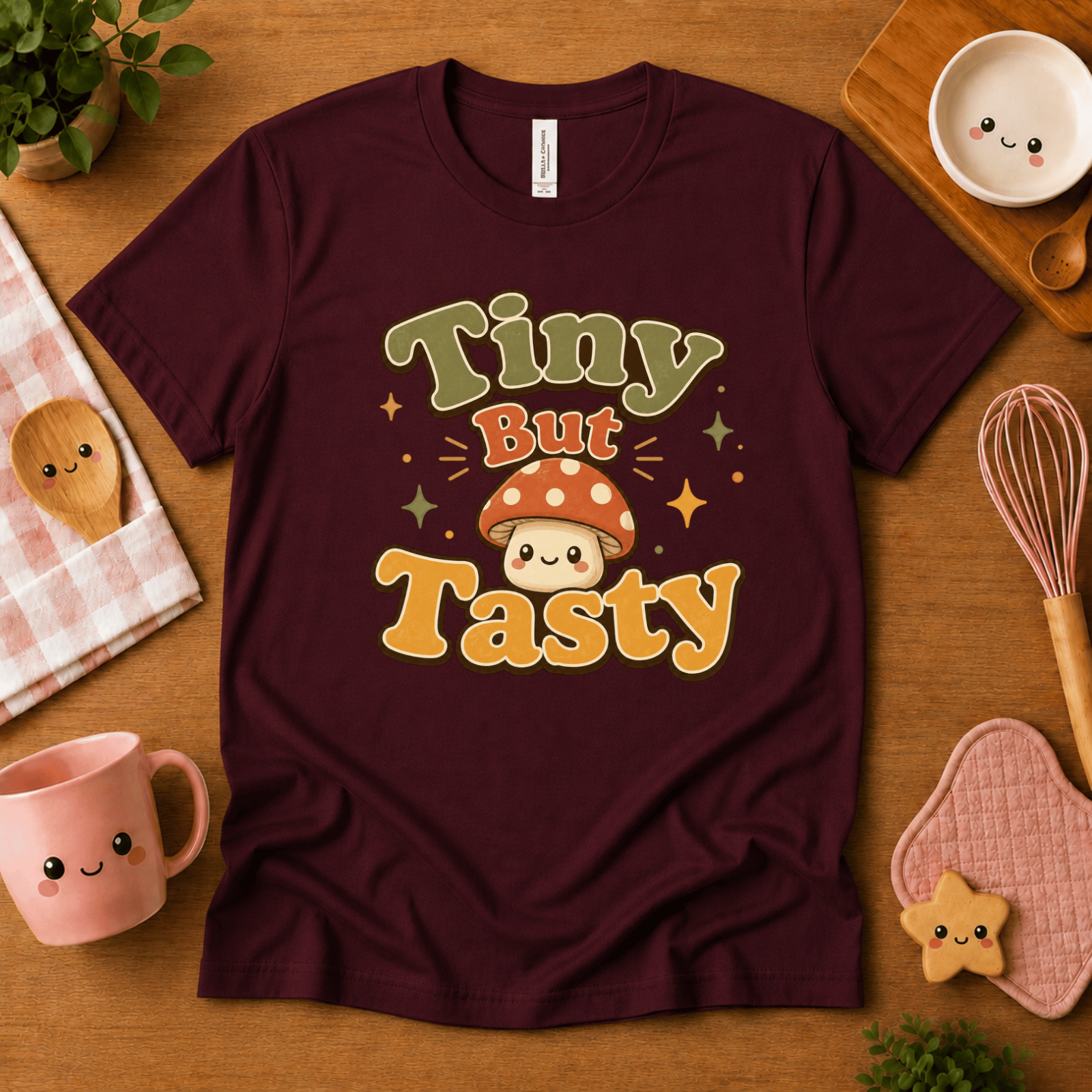 Tiny But Tasty cute food graphic t-shirt cozy flat lay in oxblood black.