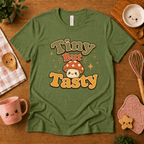 Tiny But Tasty cute food graphic t-shirt cozy flat lay in leaf.