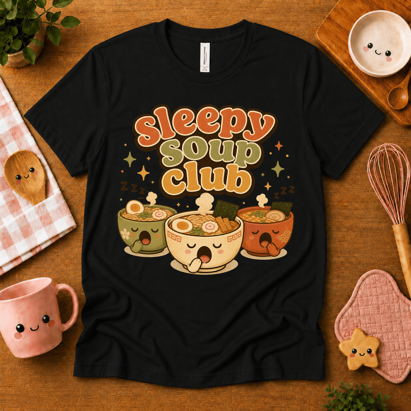 Sleepy Soup Club cute food graphic t-shirt cozy flat lay in black.