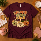Sleepy Soup Club cute food graphic t-shirt cozy flat lay in maroon.