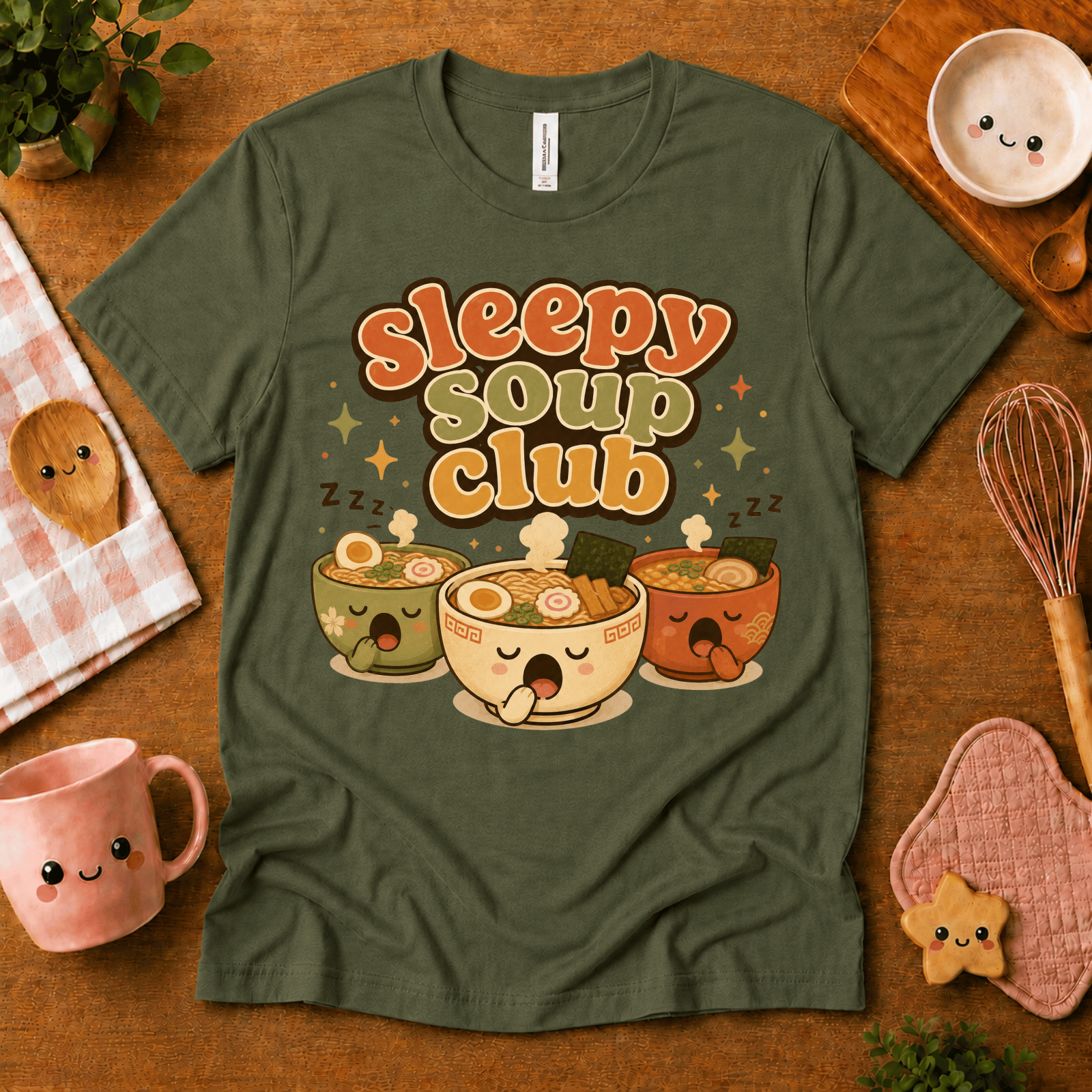 Sleepy Soup Club cute food graphic t-shirt cozy flat lay in army.