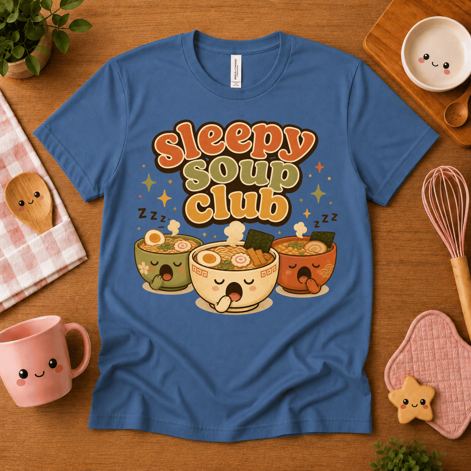 Sleepy Soup Club cute food graphic t-shirt cozy flat lay in steel blue.