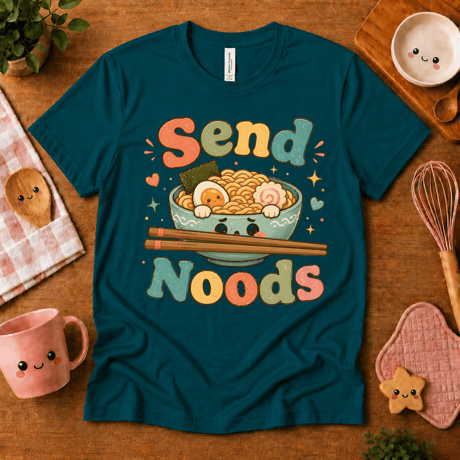 Send Noods cute food graphic t-shirt cozy flat lay in deep teal.