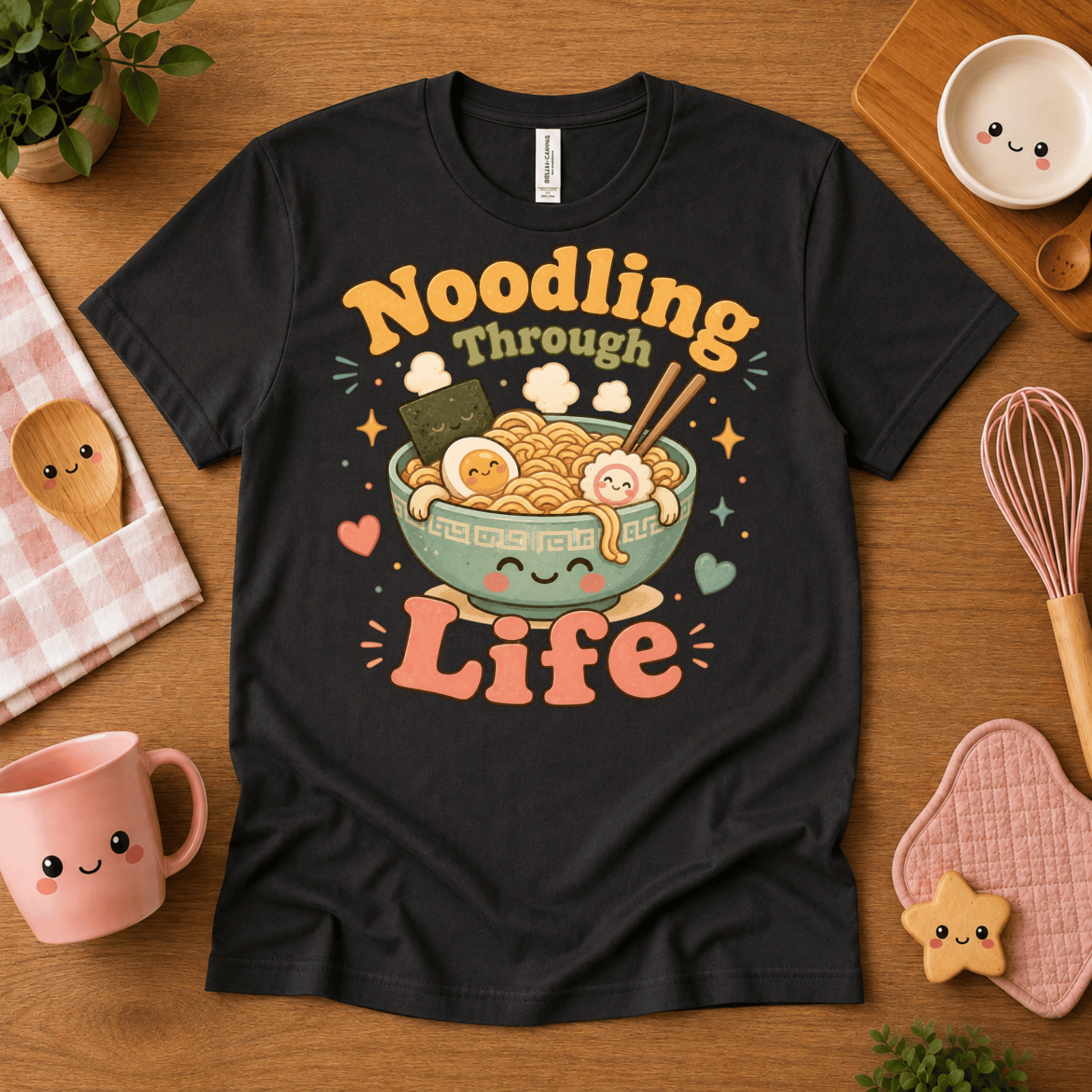 Noodling Through Life cute food graphic t-shirt cozy flat lay in vintage black.