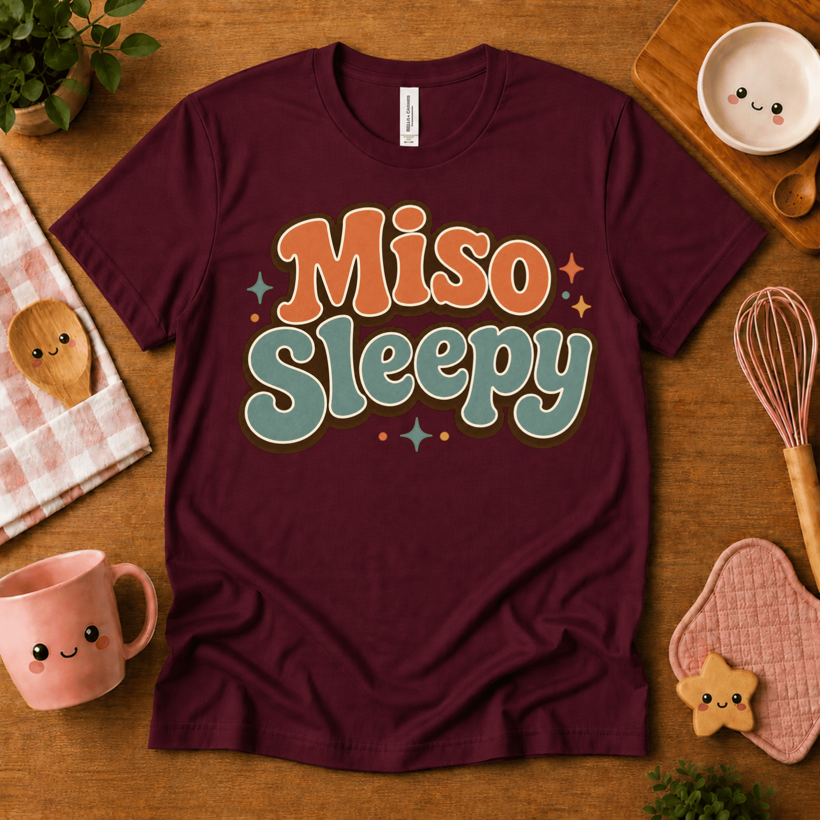 Miso Sleepy cute food graphic t-shirt cozy flat lay in maroon.