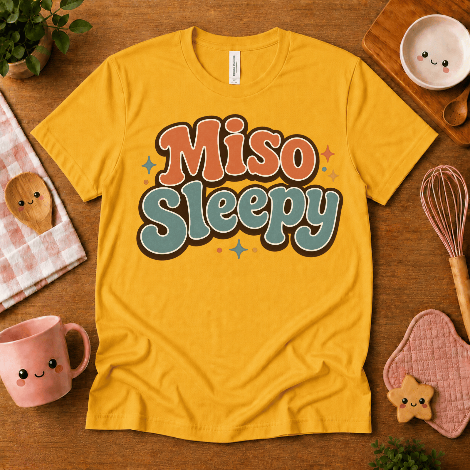 Miso Sleepy cute food graphic t-shirt cozy flat lay in gold.