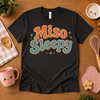 Miso Sleepy cute food graphic t-shirt cozy flat lay in vintage black.