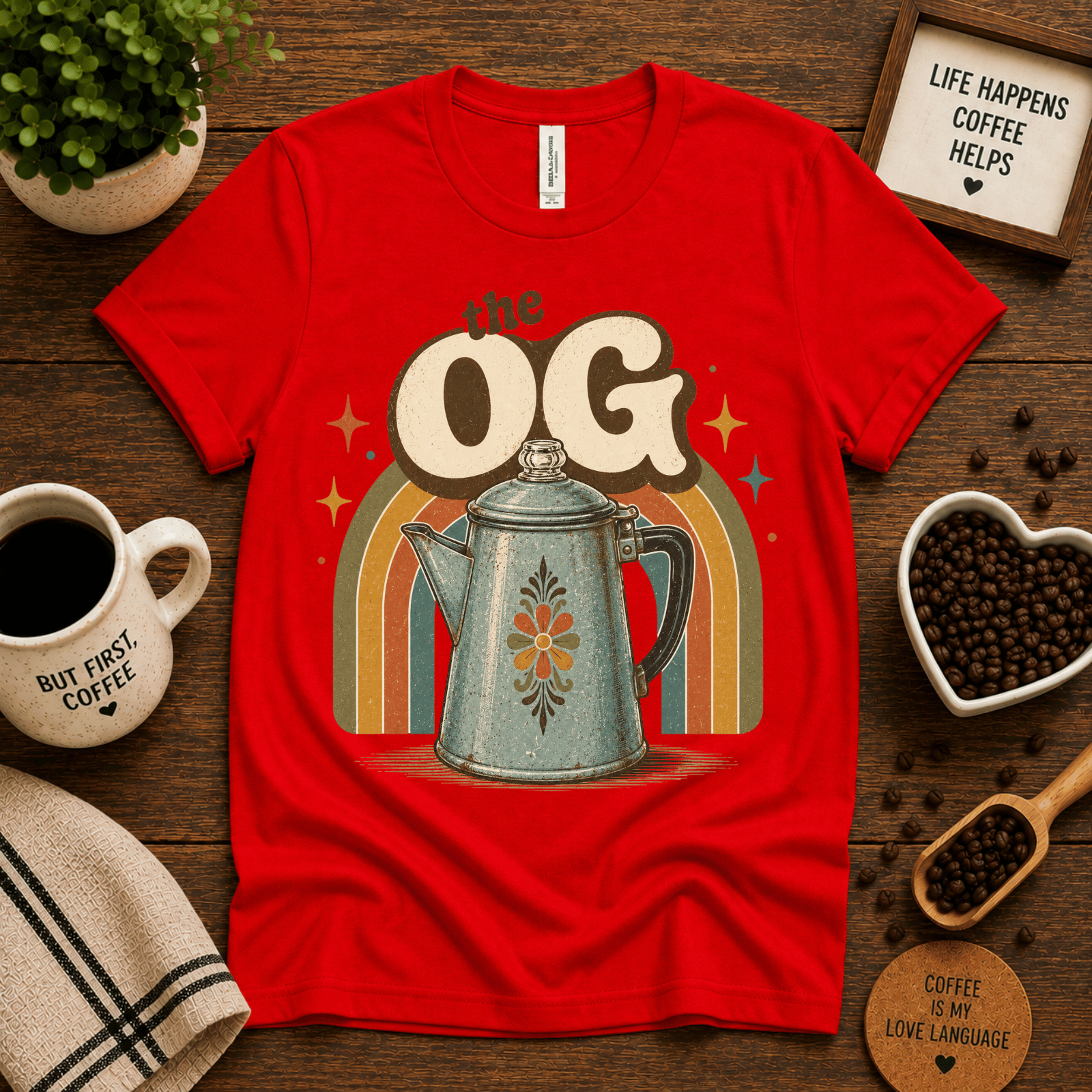 The OG coffee graphic t-shirt cozy flat lay in red.