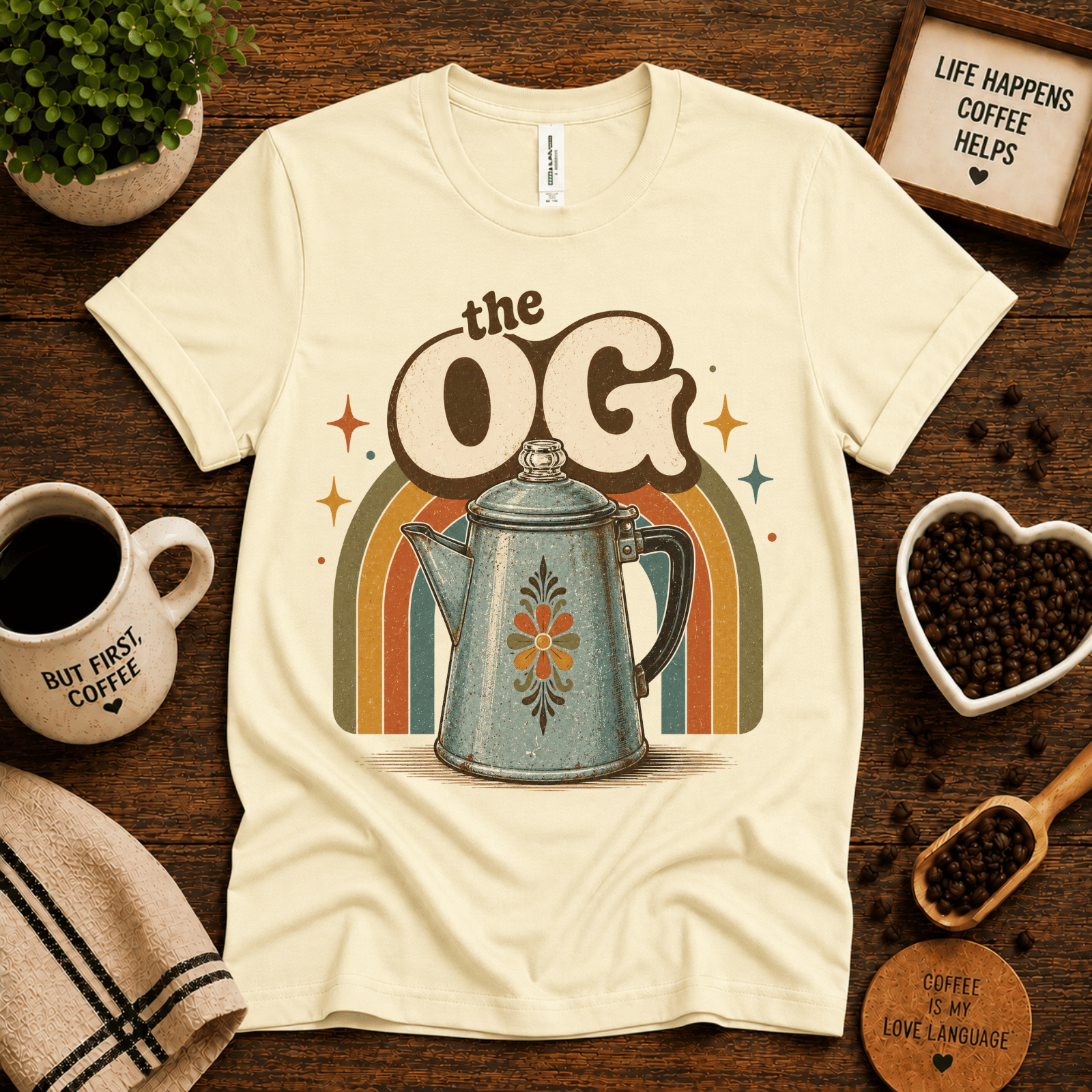 The OG coffee graphic t-shirt cozy flat lay in natural.
