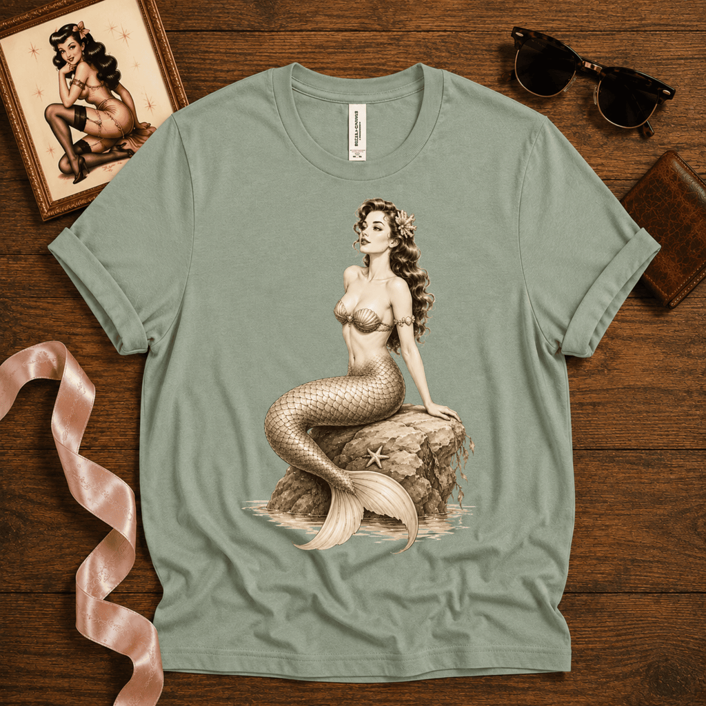 Beach Mermaid pinup graphic t-shirt cozy flat lay in sage.