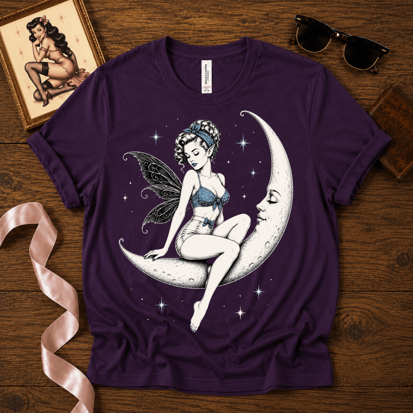 Moonlit Fairy pinup graphic t-shirt cozy flat lay in team purple.