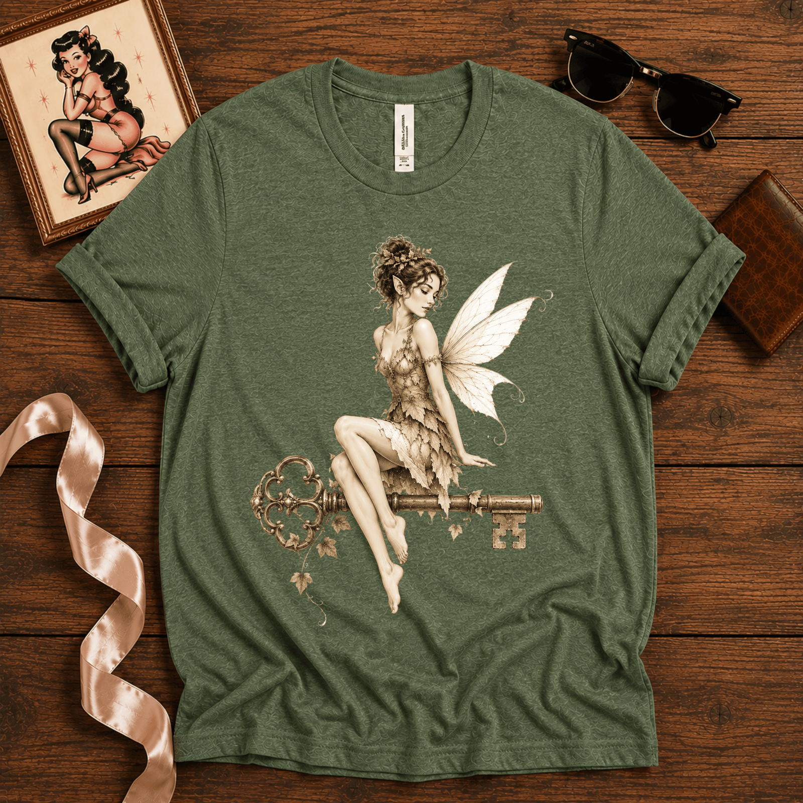 Fairy Key pinup graphic t-shirt cozy flat lay in leaf.