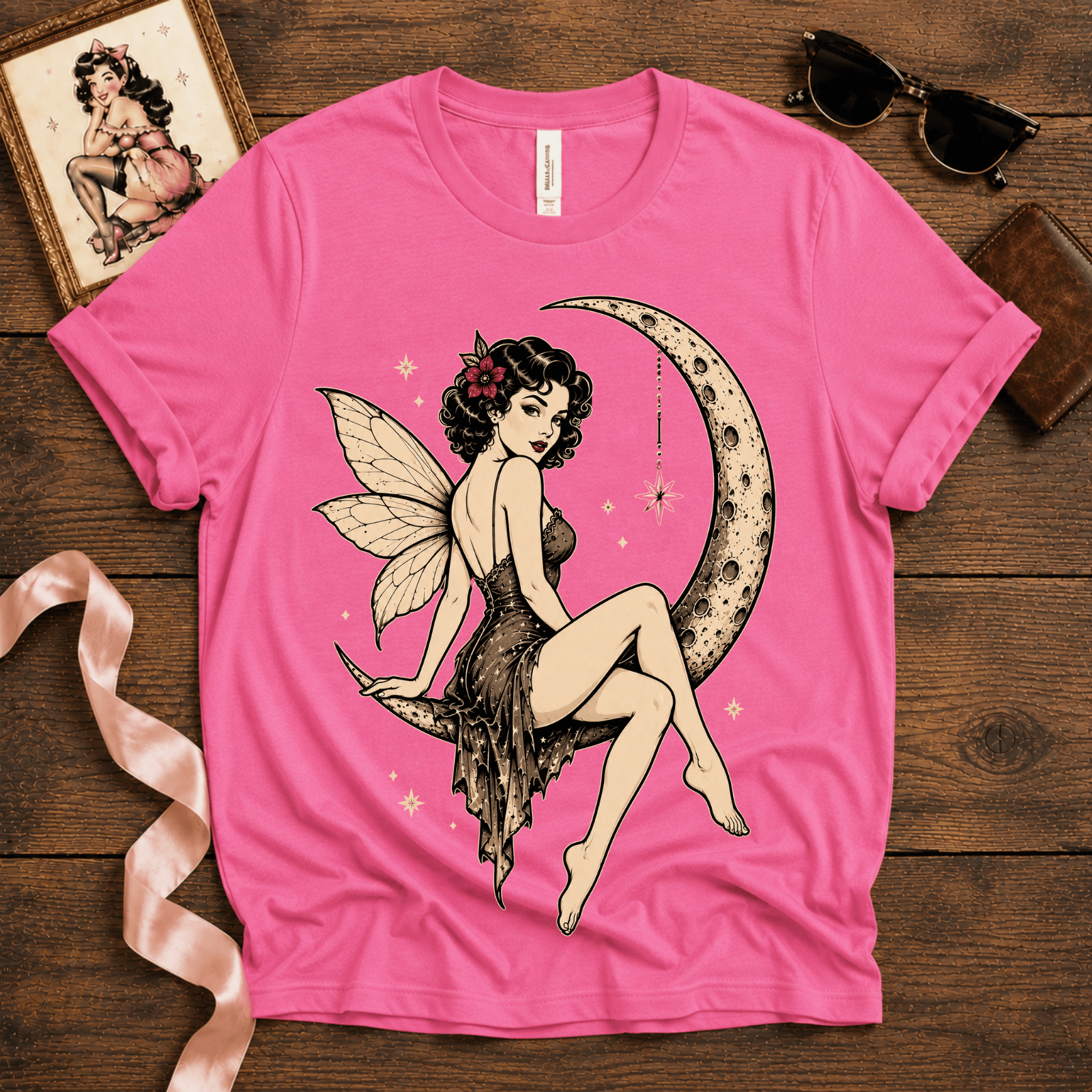 Red Rose Moon pinup fairy graphic t-shirt cozy flat lay in charity pink.