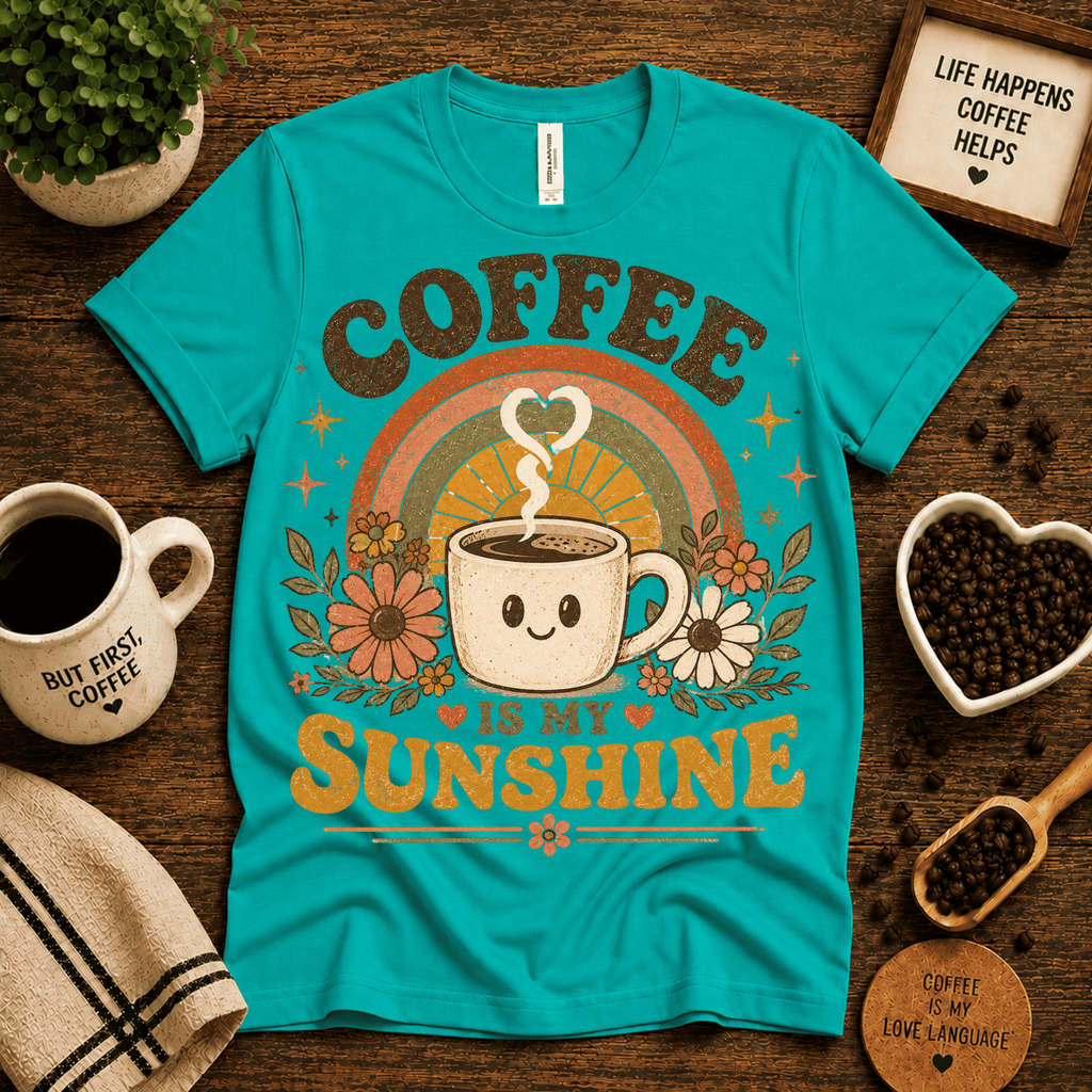 Coffee Is My Sunshine coffee graphic t-shirt cozy flat lay in heather sea green.
