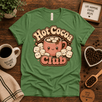 Hot Cocoa Club coffee graphic t-shirt cozy flat lay in leaf.