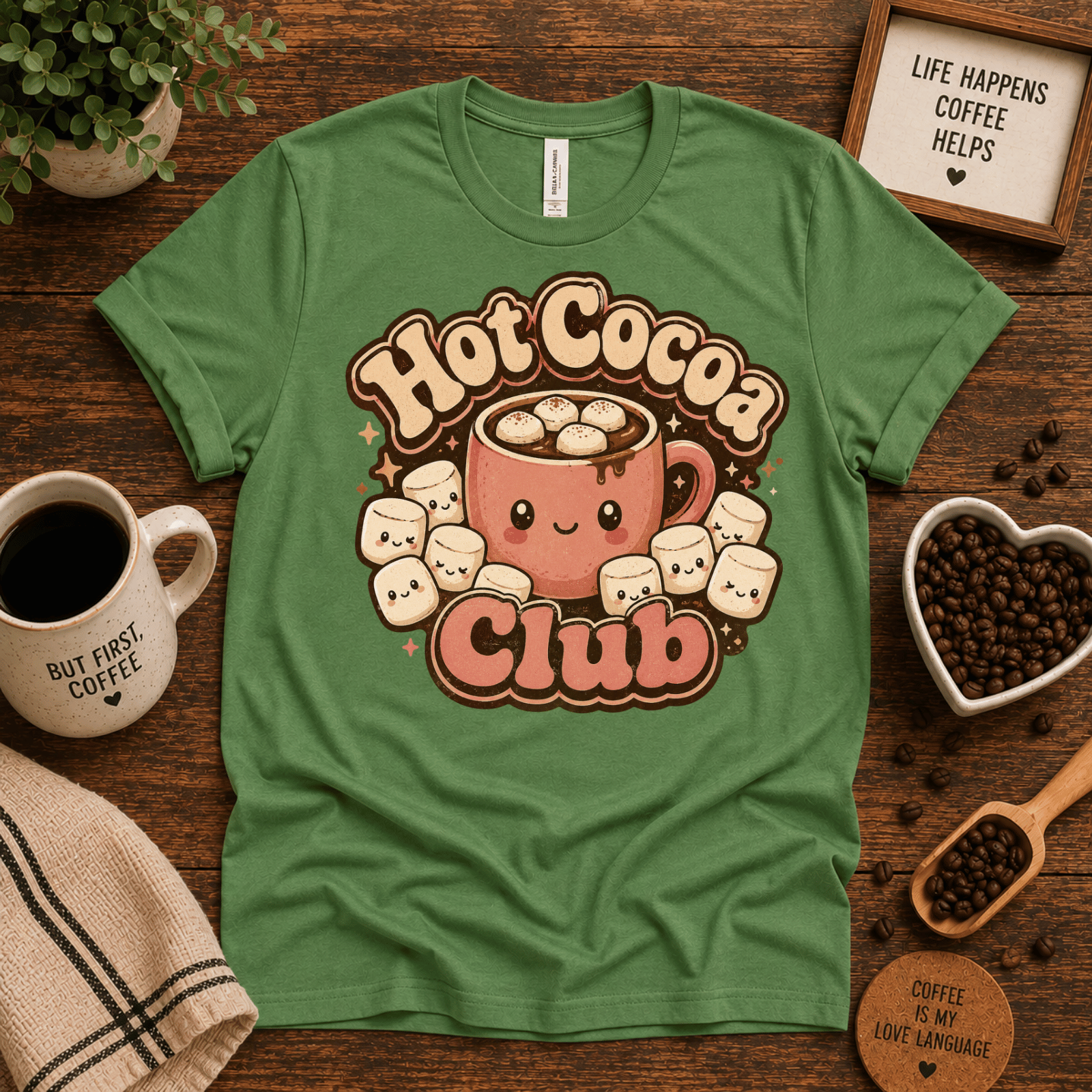 Hot Cocoa Club coffee graphic t-shirt cozy flat lay in leaf.