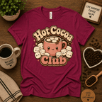 Hot Cocoa Club coffee graphic t-shirt cozy flat lay in berry.