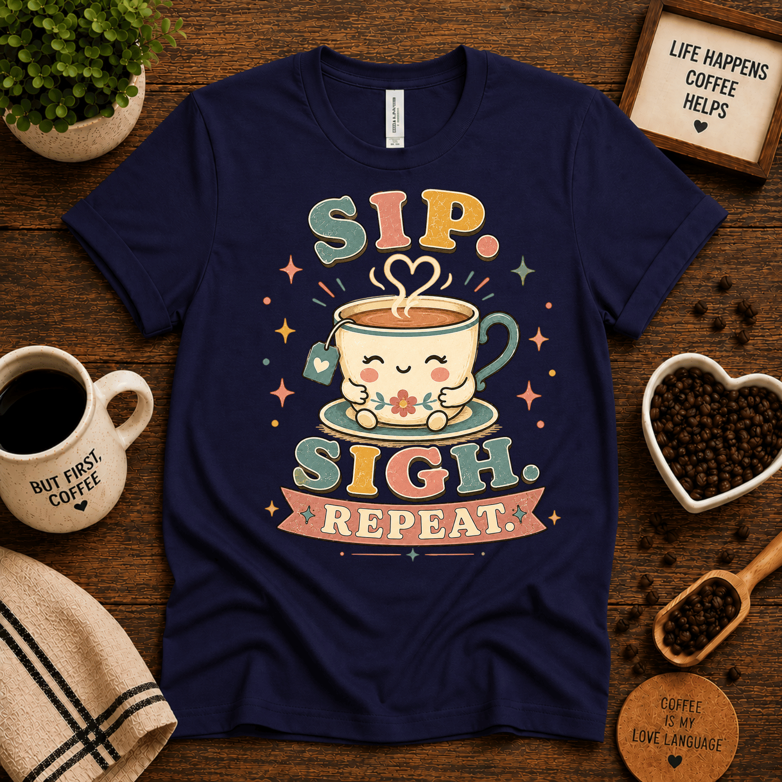 Sip. Sigh. Repeat. coffee graphic t-shirt cozy flat lay in navy.