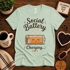 Social Battery of Tea graphic t-shirt cozy flat lay in mint.