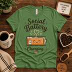 Social Battery of Tea graphic t-shirt cozy flat lay in leaf.
