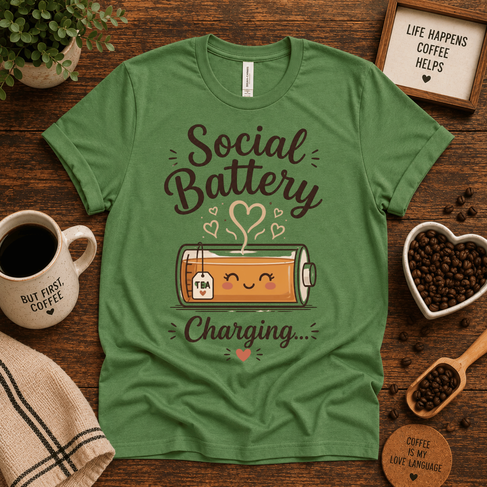 Social Battery of Tea graphic t-shirt cozy flat lay in leaf.