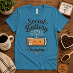 Social Battery of Tea graphic t-shirt cozy flat lay in aqua.