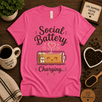 Social Battery of Tea graphic t-shirt cozy flat lay in charity pink.