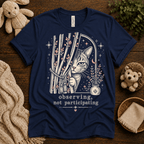 Cat Observing cute animal graphic t-shirt cozy flat lay in navy.