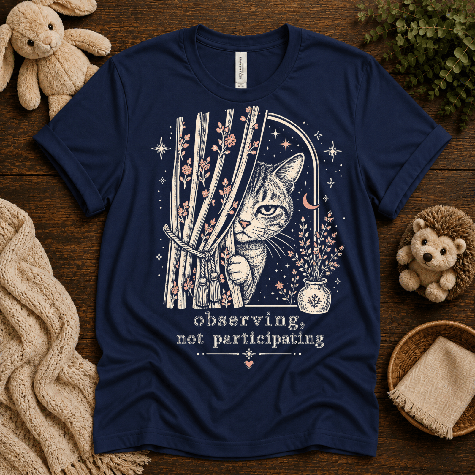Cat Observing cute animal graphic t-shirt cozy flat lay in navy.