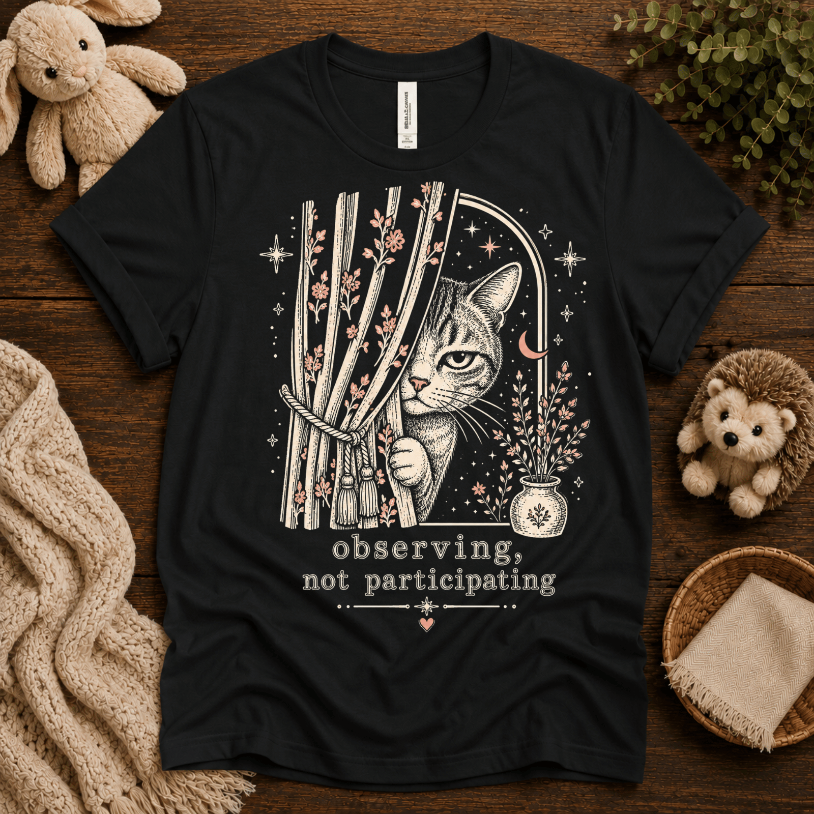 Cat Observing cute animal graphic t-shirt cozy flat lay in vintage black.