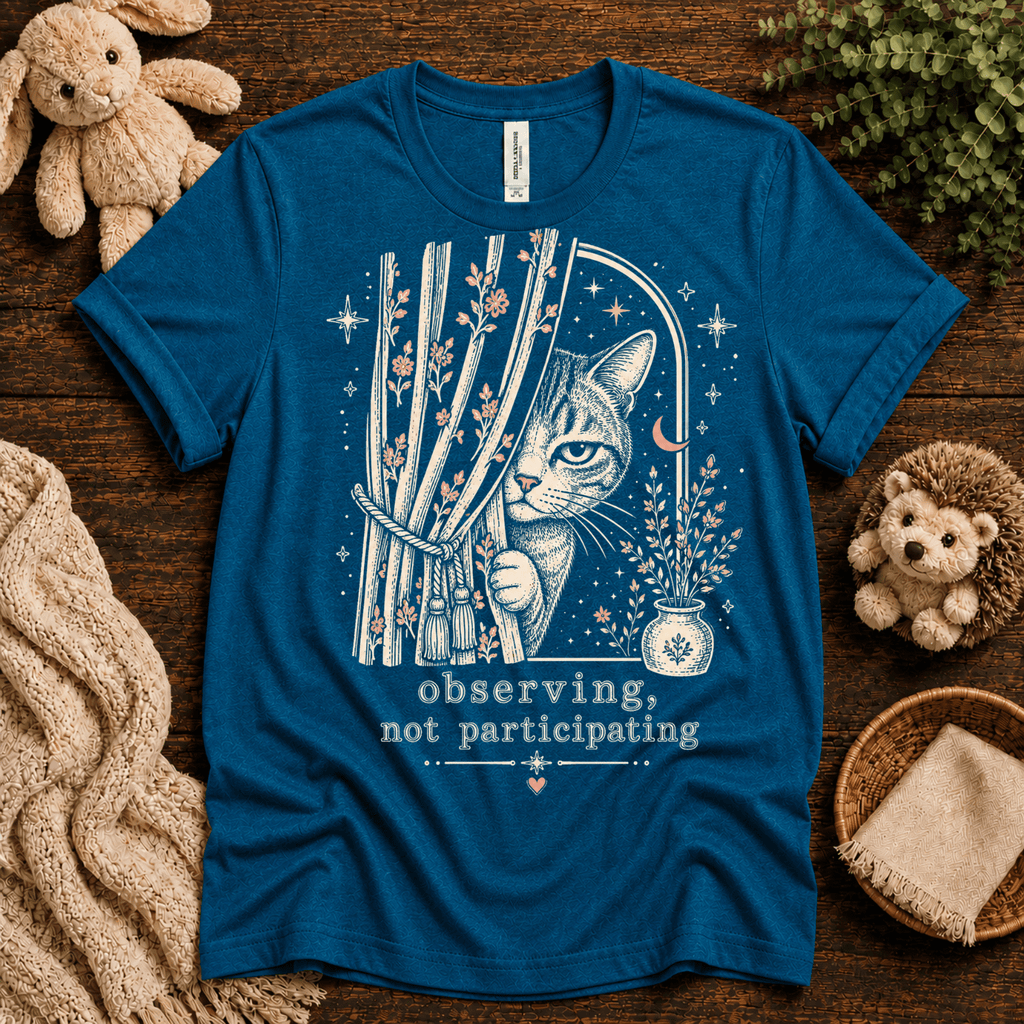 Cat Observing cute animal graphic t-shirt cozy flat lay in deep teal.