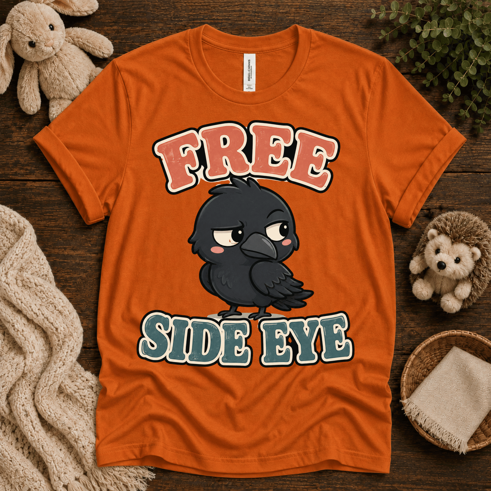 Free Side Eye cute animal graphic t-shirt cozy flat lay in burnt orange.