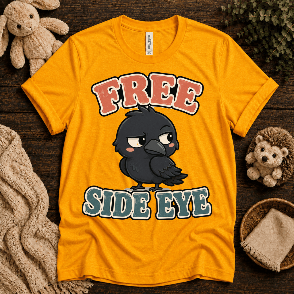 Free Side Eye cute animal graphic t-shirt cozy flat lay in gold.