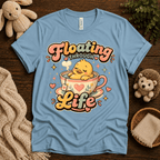 Floating Through Life cute animal graphic t-shirt cozy flat lay in baby blue.