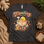 Floating Through Life cute animal graphic t-shirt cozy flat lay in asphalt.