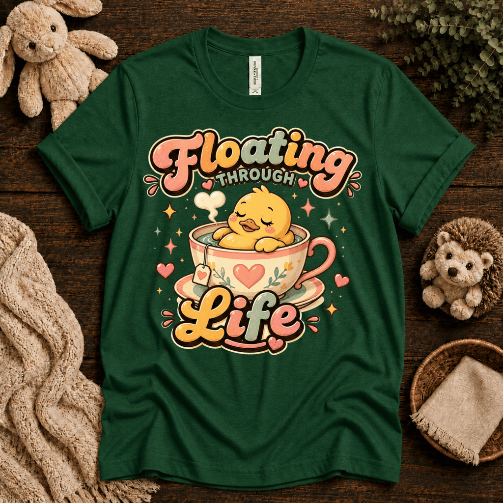Floating Through Life cute animal graphic t-shirt cozy flat lay in evergreen.