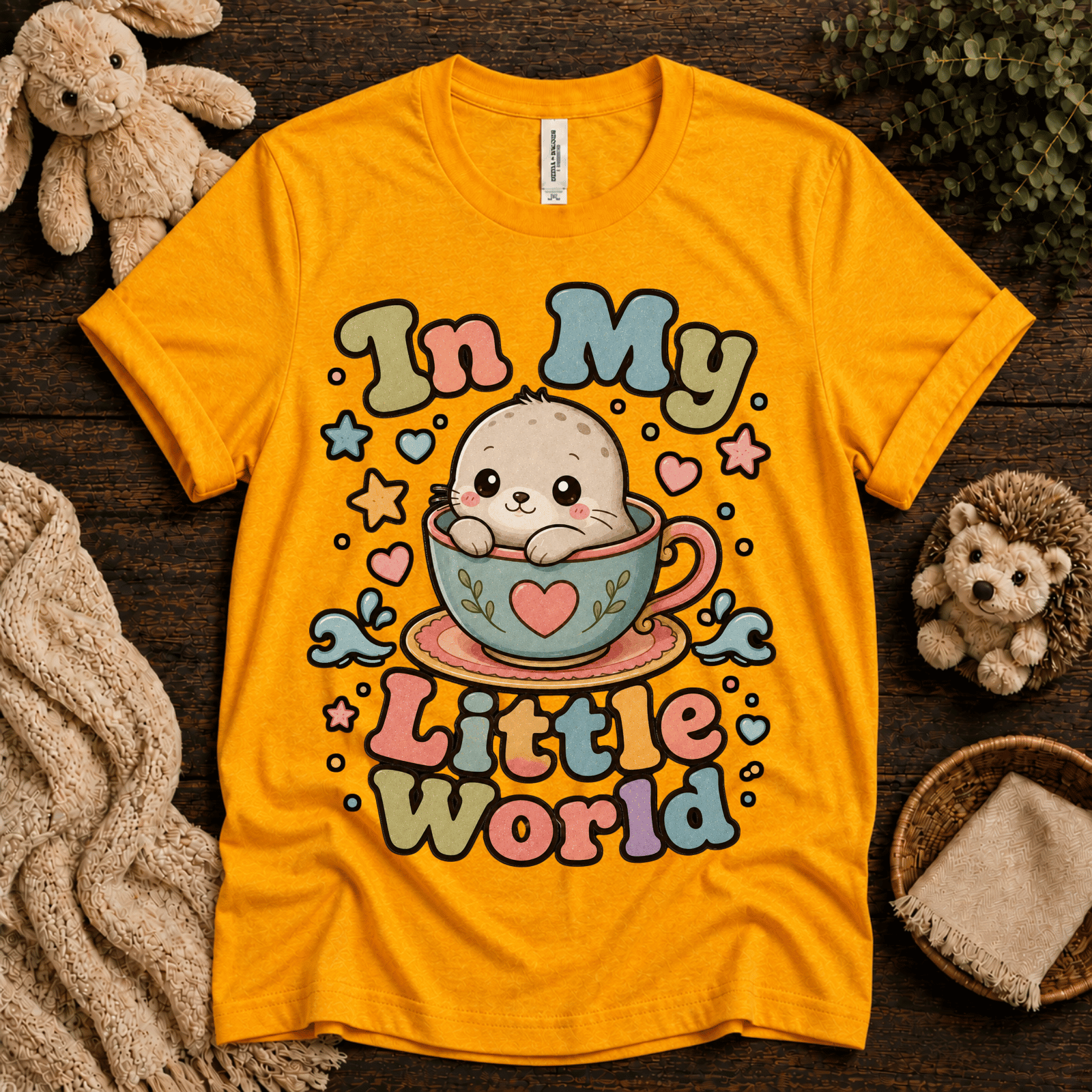 In My Little World cute animal graphic t-shirt cozy flat lay in gold.