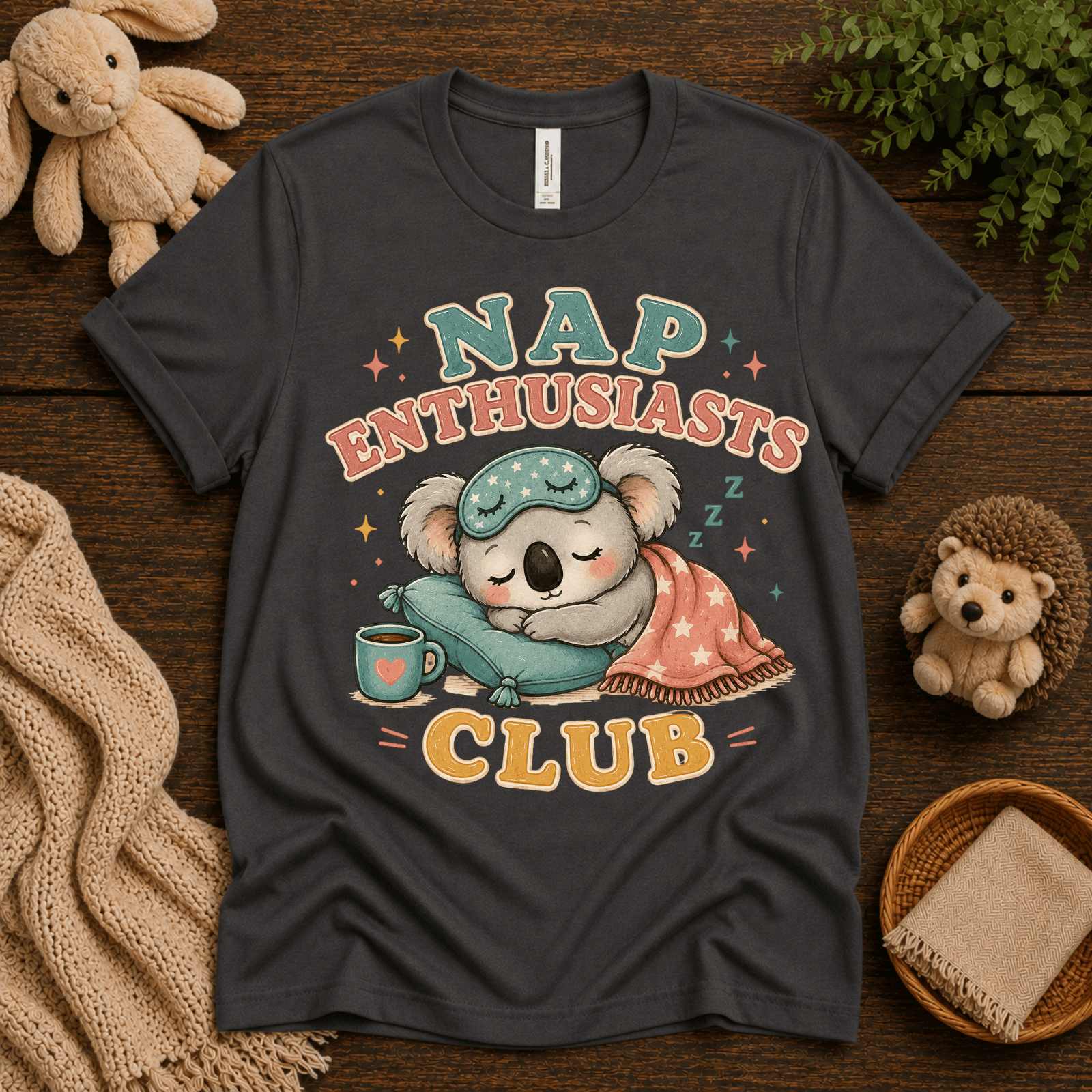 Nap Enthusiasts Club cute animal graphic t-shirt cozy flat lay in asphalt.