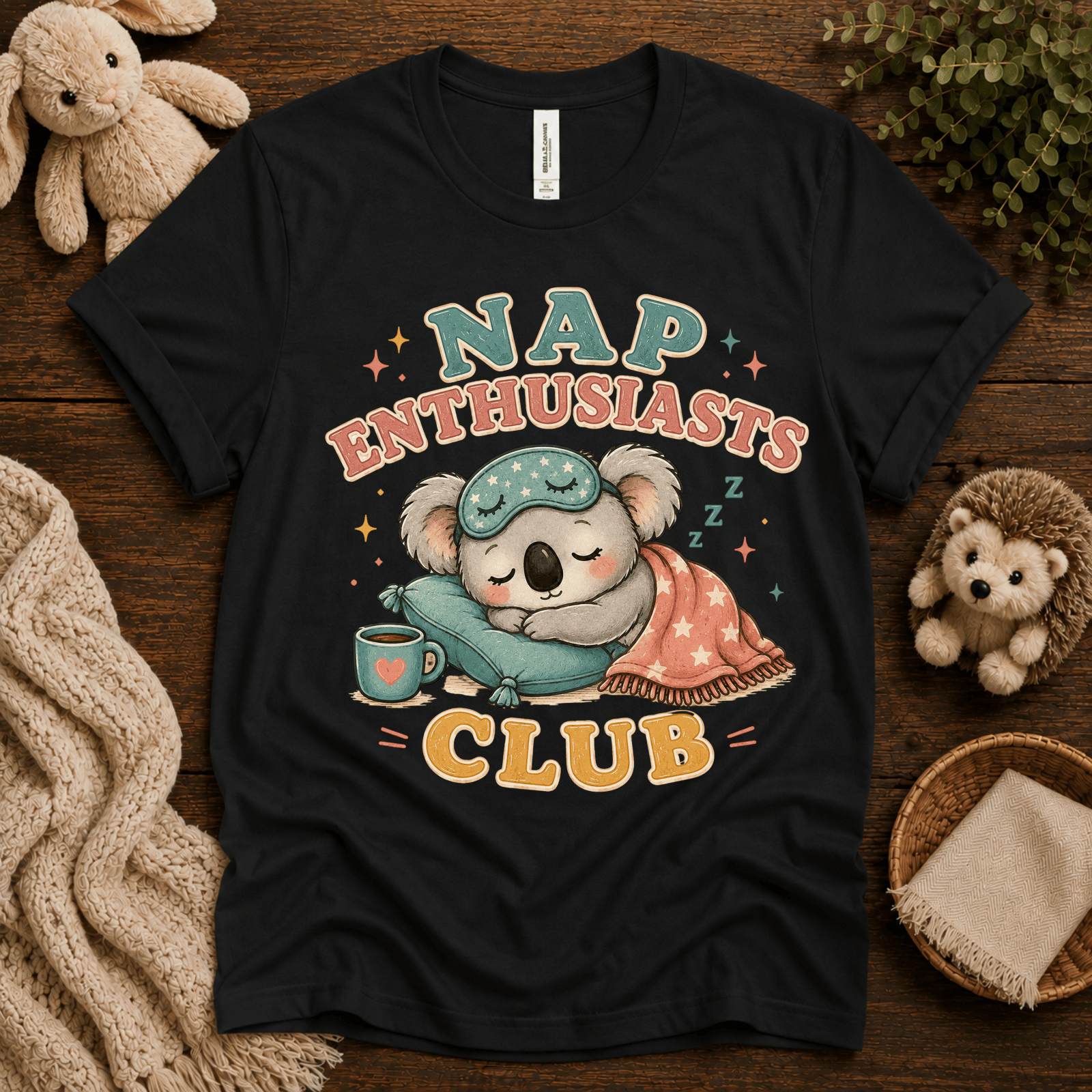 Nap Enthusiasts Club cute animal graphic t-shirt cozy flat lay in vintage black.