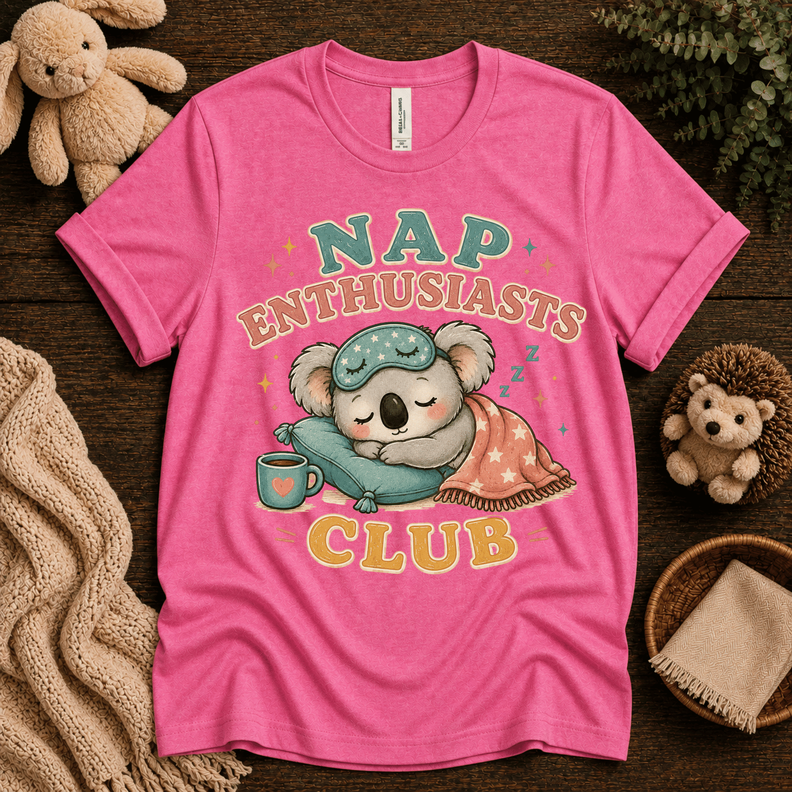 Nap Enthusiasts Club cute animal graphic t-shirt cozy flat lay in charity pink.