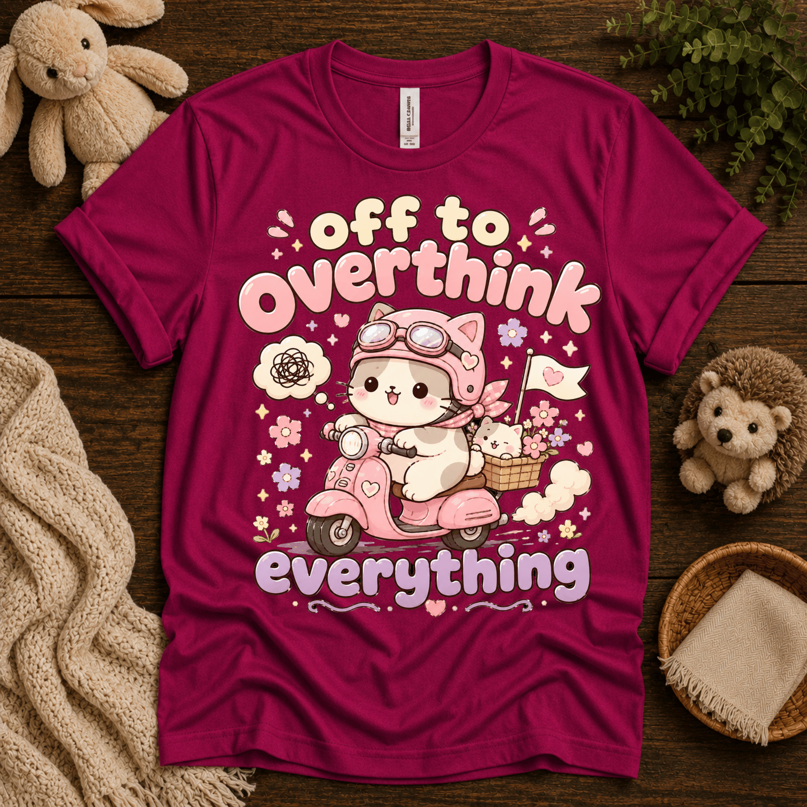 Overthink Cat cute animal graphic t-shirt cozy flat lay in berry.