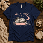 Recharging Cat cute animal graphic t-shirt cozy flat lay in navy.