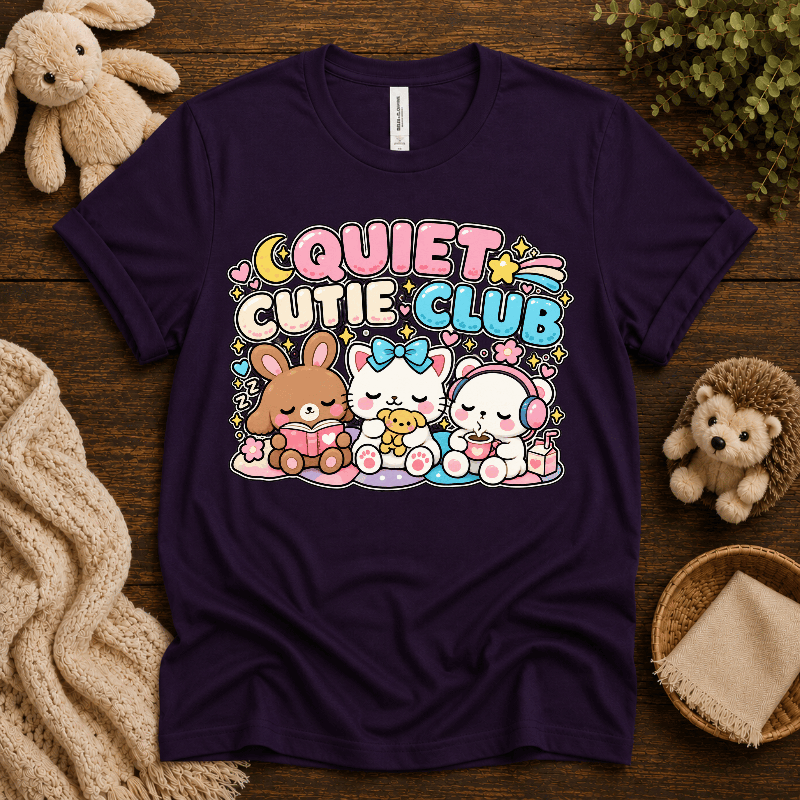 Quiet Cutie Club cute animal graphic t-shirt cozy flat lay in team purple.