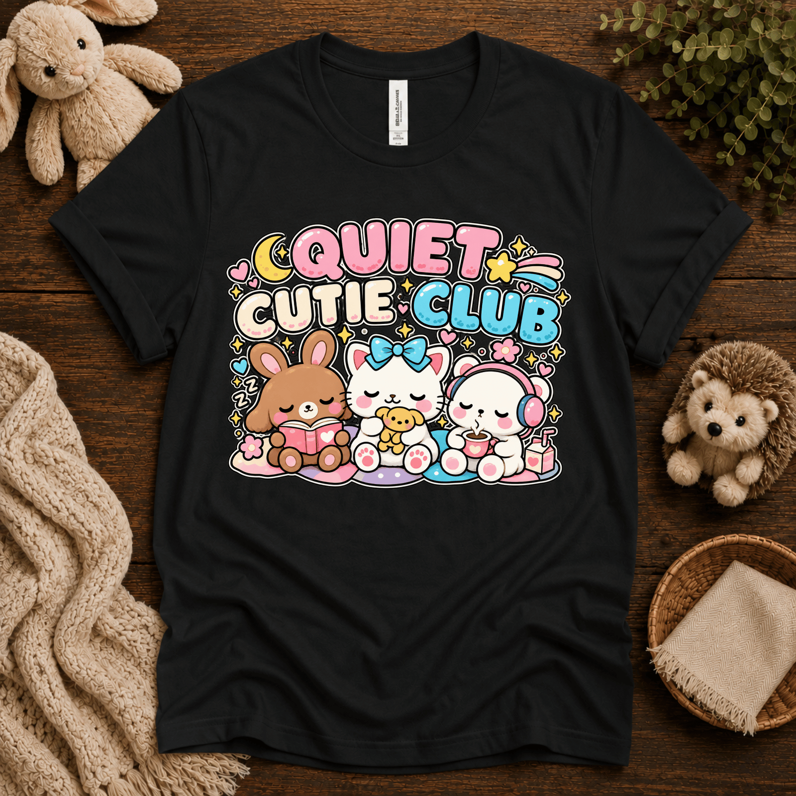 Quiet Cutie Club cute animal graphic t-shirt cozy flat lay in vintage black.