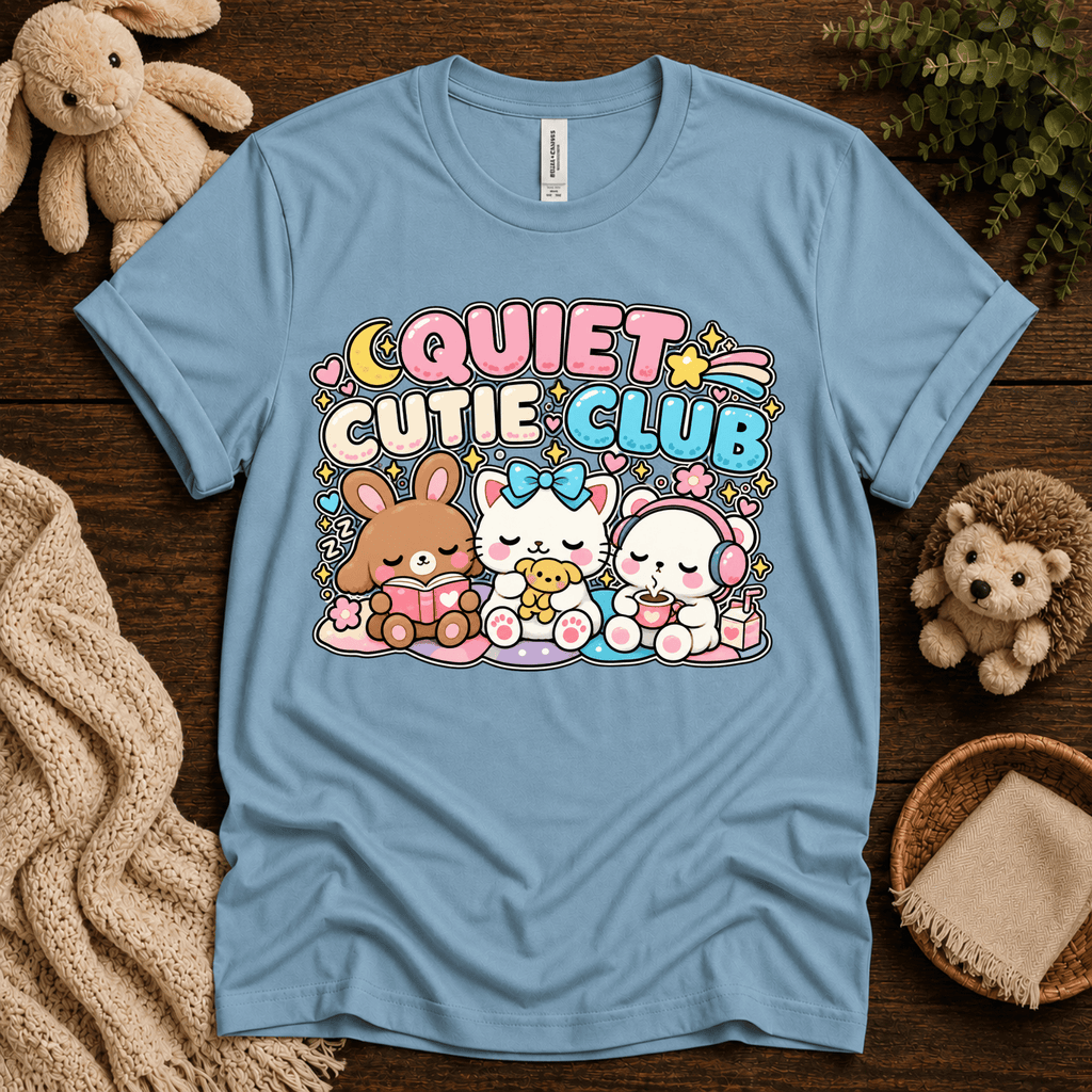 Quiet Cutie Club cute animal graphic t-shirt cozy flat lay in baby blue.