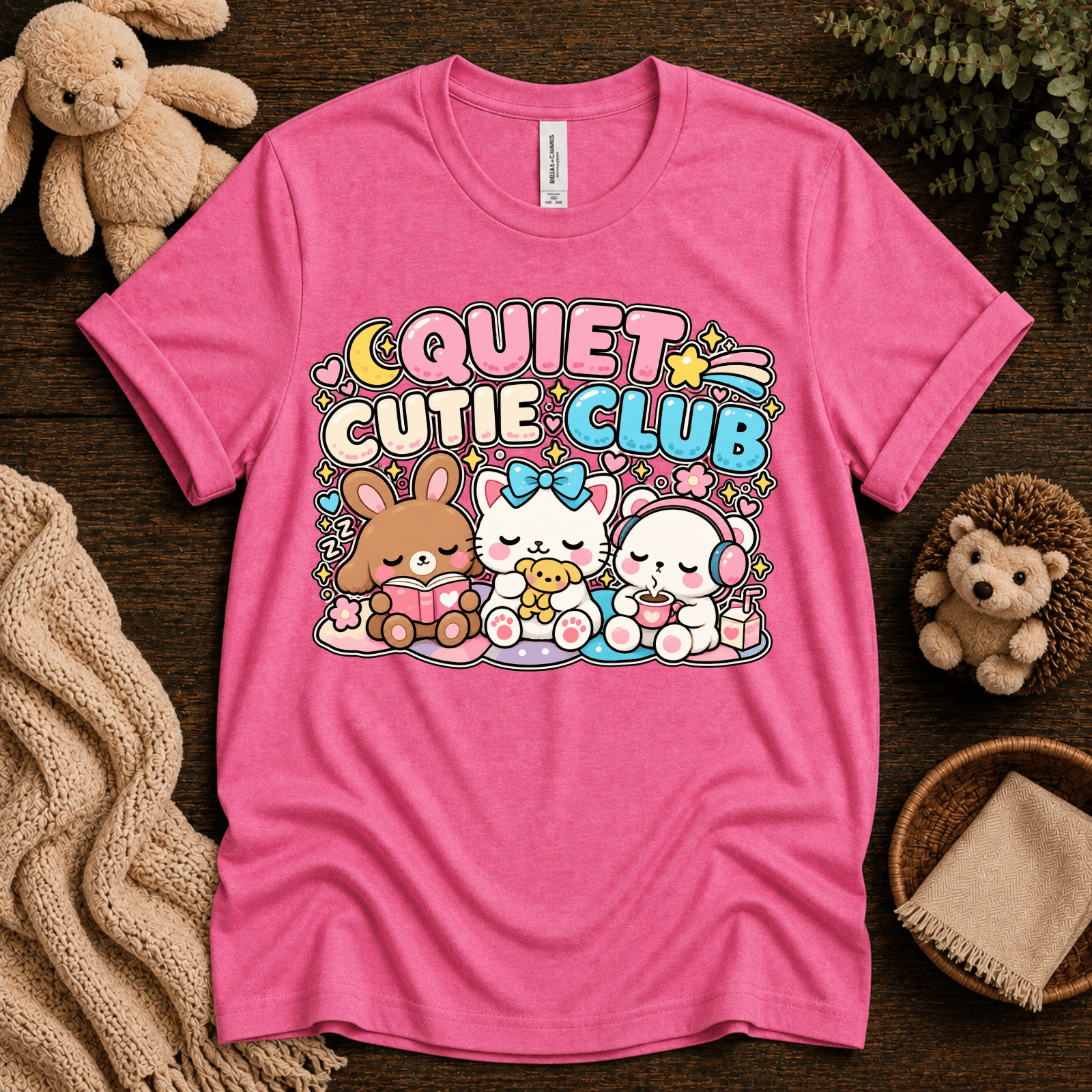 Quiet Cutie Club cute animal graphic t-shirt cozy flat lay in charity pink.