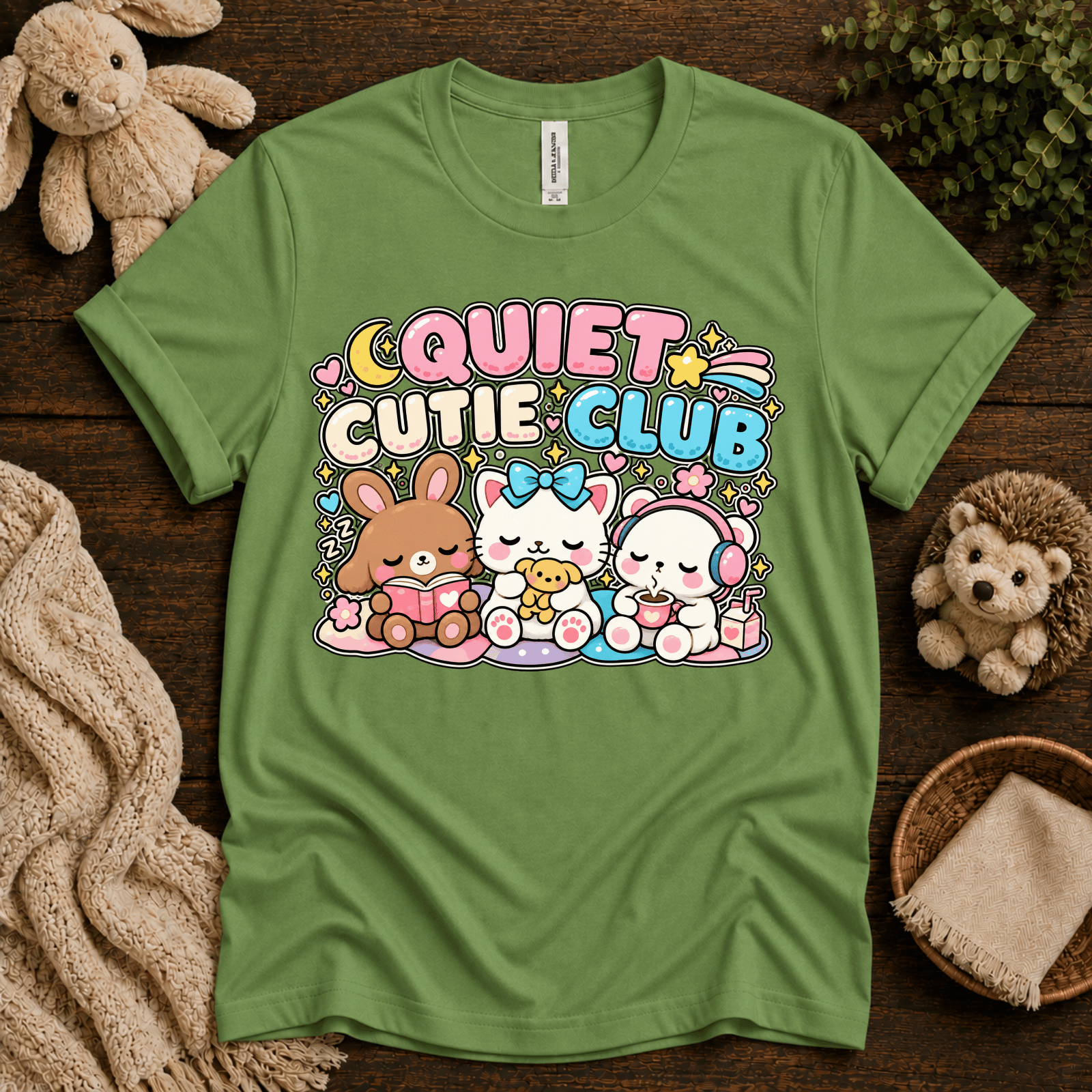 Quiet Cutie Club cute animal graphic t-shirt cozy flat lay in leaf.