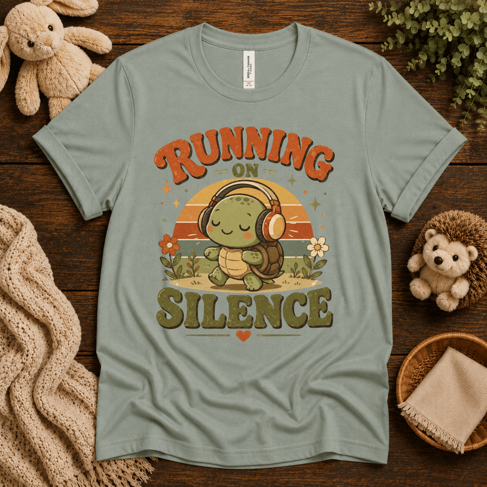 Running On Silence cute animal graphic t-shirt cozy flat lay in sage.