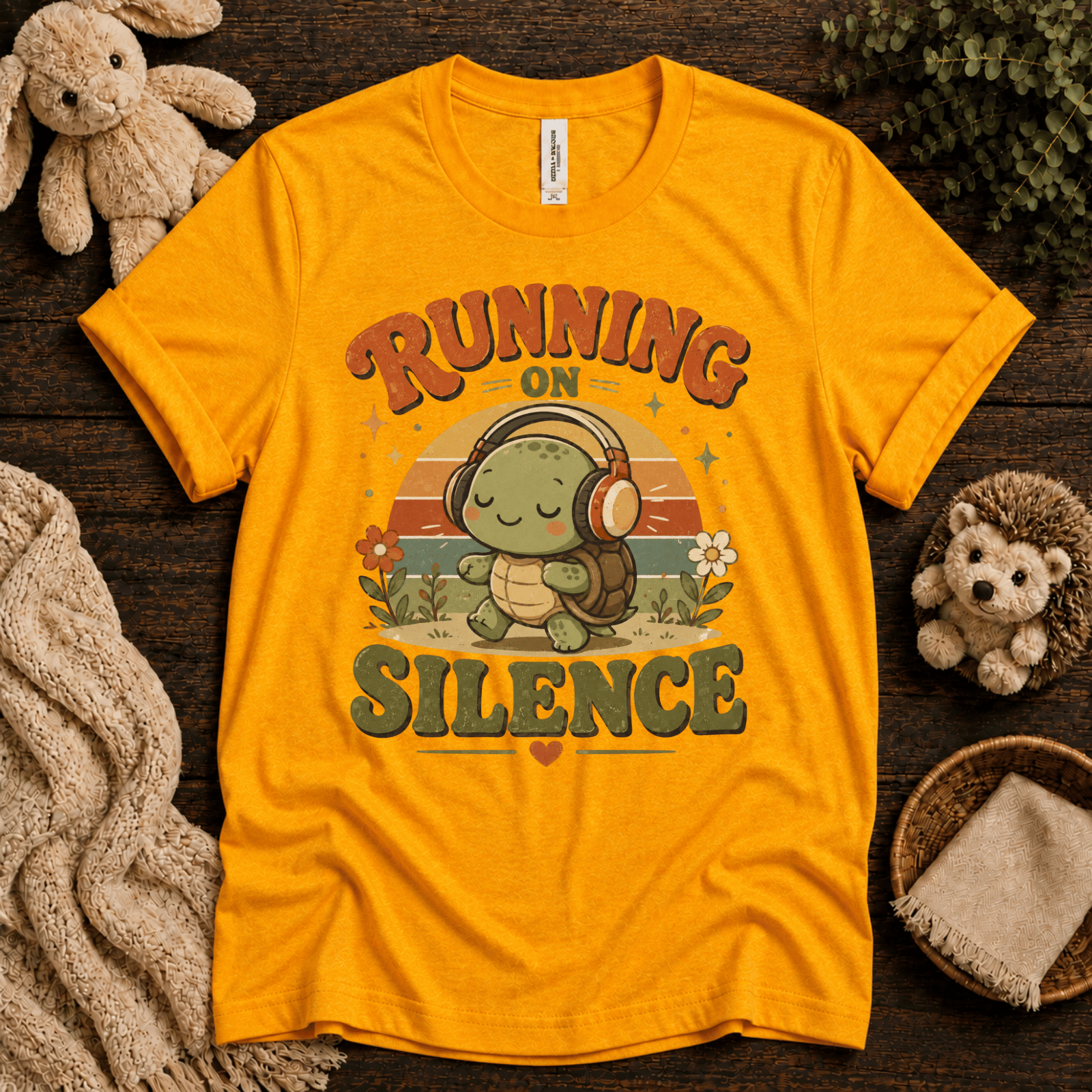 Running On Silence cute animal graphic t-shirt cozy flat lay in gold.